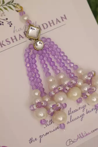 Lavender pearl tassel beaded designer lumba with roli chawal capsules