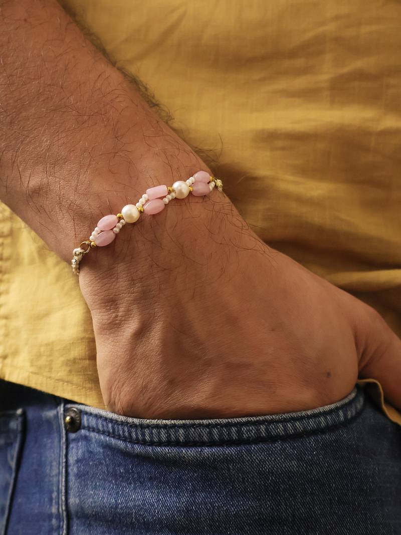 Pink pearl beaded designer rakhi with roli chawal capsules