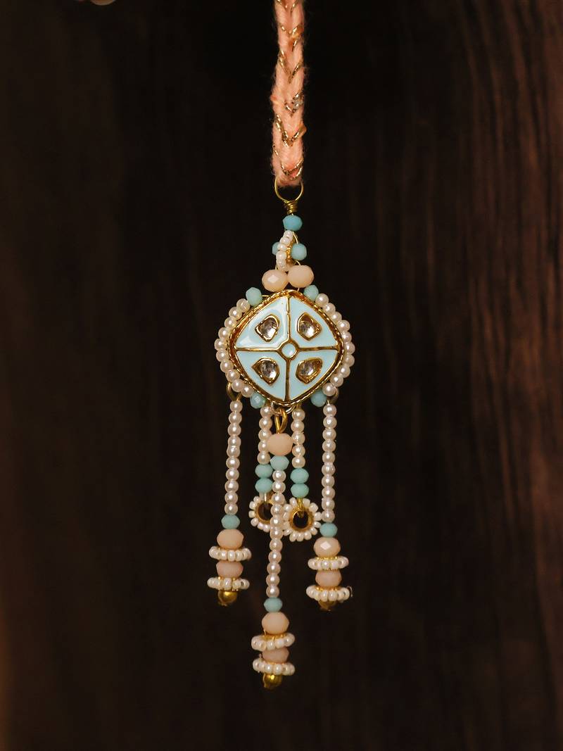 Pastel kundan tassel pearl charm lumba with roli chawal capsules