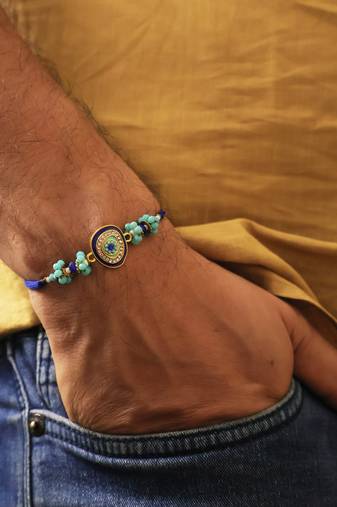 Blue evil eye beaded rakhi with roli chawal capsules