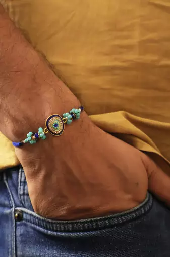 Blue evil eye beaded rakhi with roli chawal capsules