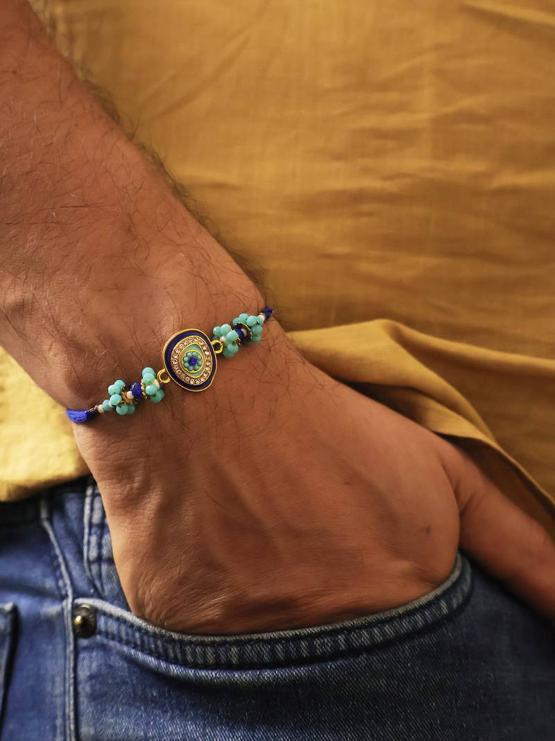 Blue evil eye beaded rakhi with roli chawal capsules
