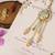 Pastel kundan tassel pearl charm lumba with roli chawal capsules