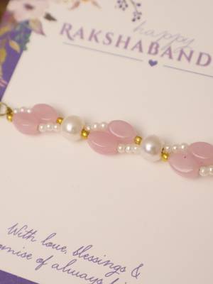 Pink pearl beaded designer rakhi with roli chawal capsules 3