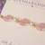 Pink pearl beaded designer rakhi with roli chawal capsules
