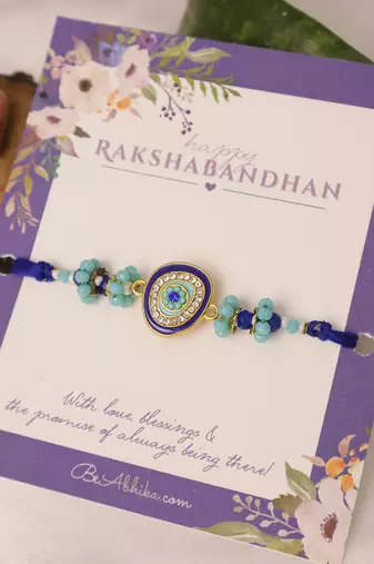 Blue evil eye beaded rakhi with roli chawal capsules