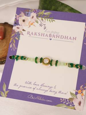 Green beaded floral charm rakhi with roli chawal capsules 2