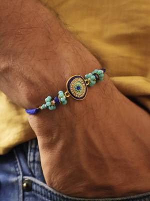 Blue evil eye beaded rakhi with roli chawal capsules 3