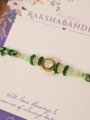 Green beaded floral charm rakhi with roli chawal capsules 3