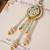 Pastel kundan tassel pearl charm lumba with roli chawal capsules
