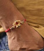 Lotus kundan stone designer rakhi with roli chawal capsules
