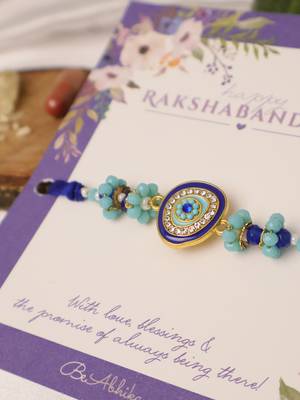 Blue evil eye beaded rakhi with roli chawal capsules 4