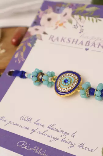 Blue evil eye beaded rakhi with roli chawal capsules