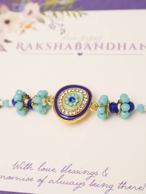 Blue evil eye beaded rakhi with roli chawal capsules 5