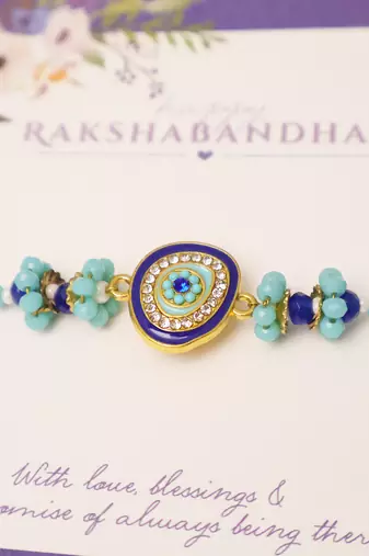 Blue evil eye beaded rakhi with roli chawal capsules