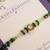Green beaded floral charm rakhi with roli chawal capsules