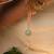 Pastel kundan tassel pearl charm lumba with roli chawal capsules