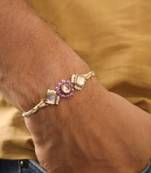 Purple floral pearl stone rakhi with roli chawal capsules