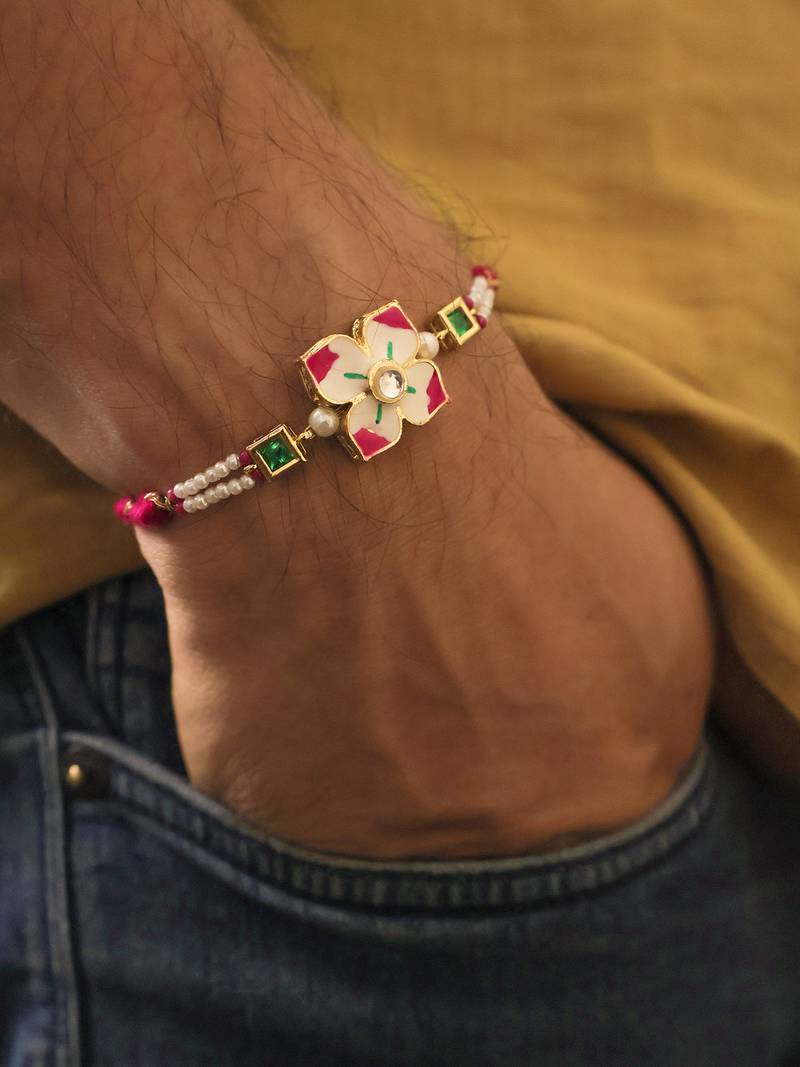 Floral kundan pearl designer rakhi with roli chawal capsules
