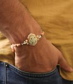 Pastel kundan pearl charm rakhi with roli chawal capsules