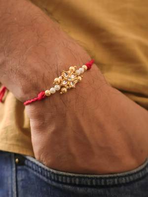 Kundan floral pearl red rakhi with roli chawal capsules 1