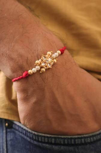 Kundan floral pearl red rakhi with roli chawal capsules