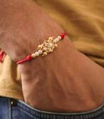 Kundan floral pearl red rakhi with roli chawal capsules