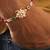Floral kundan pearl designer rakhi with roli chawal capsules