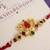 Lotus kundan stone designer rakhi with roli chawal capsules
