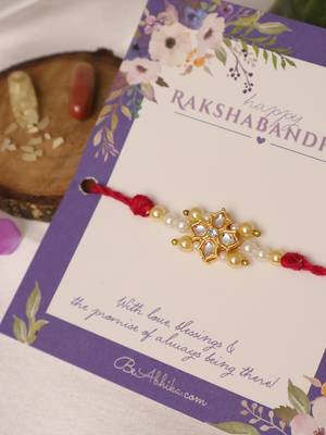 Kundan floral pearl red rakhi with roli chawal capsules 2