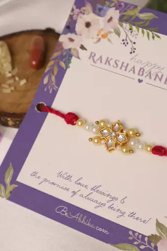Kundan floral pearl red rakhi with roli chawal capsules