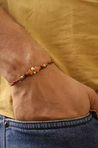 Amber diamond beaded thread rakhi with roli chawal capsules