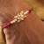 Kundan floral pearl red rakhi with roli chawal capsules