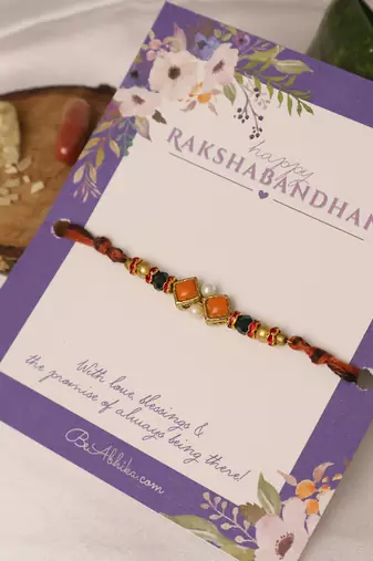 Amber diamond beaded thread rakhi with roli chawal capsules