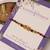 Amber diamond beaded thread rakhi with roli chawal capsules