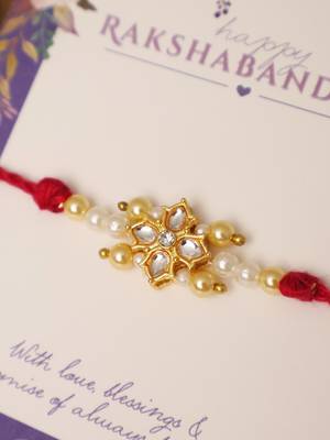 Kundan floral pearl red rakhi with roli chawal capsules 4