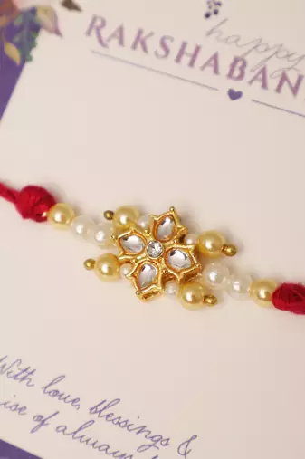 Kundan floral pearl red rakhi with roli chawal capsules