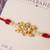 Kundan floral pearl red rakhi with roli chawal capsules