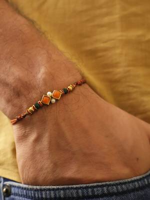 Amber diamond beaded thread rakhi with roli chawal capsules 3