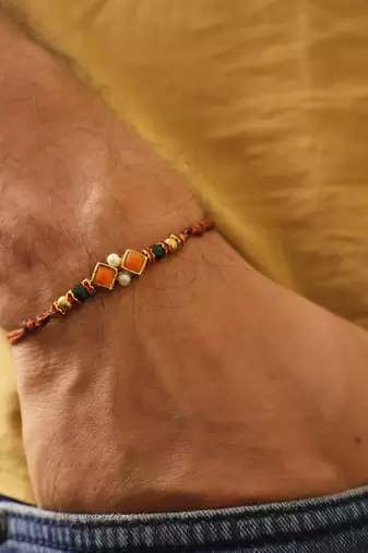 Amber diamond beaded thread rakhi with roli chawal capsules