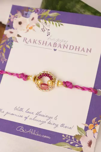 Purple crystal halo beaded rakhi with roli chawal capsules