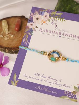 Sky blue crystal halo rakhi with roli chawal capsules 2
