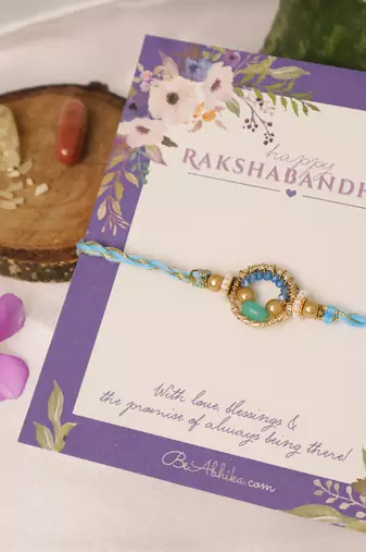 Sky blue crystal halo rakhi with roli chawal capsules