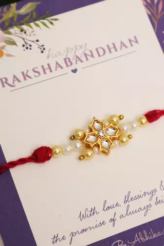 Kundan floral pearl red rakhi with roli chawal capsules