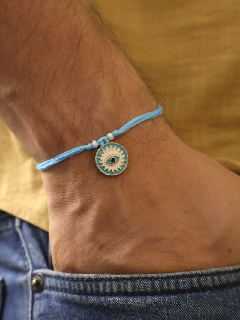 Blue evil eye protection rakhi with roli chawal capsules
