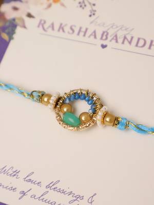 Sky blue crystal halo rakhi with roli chawal capsules 3