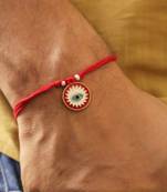 Red evil eye protection rakhi with roli chawal capsules