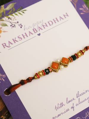 Amber diamond beaded thread rakhi with roli chawal capsules 5