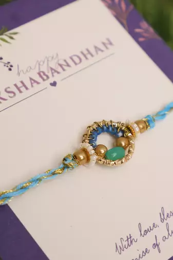 Sky blue crystal halo rakhi with roli chawal capsules