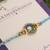 Sky blue crystal halo rakhi with roli chawal capsules